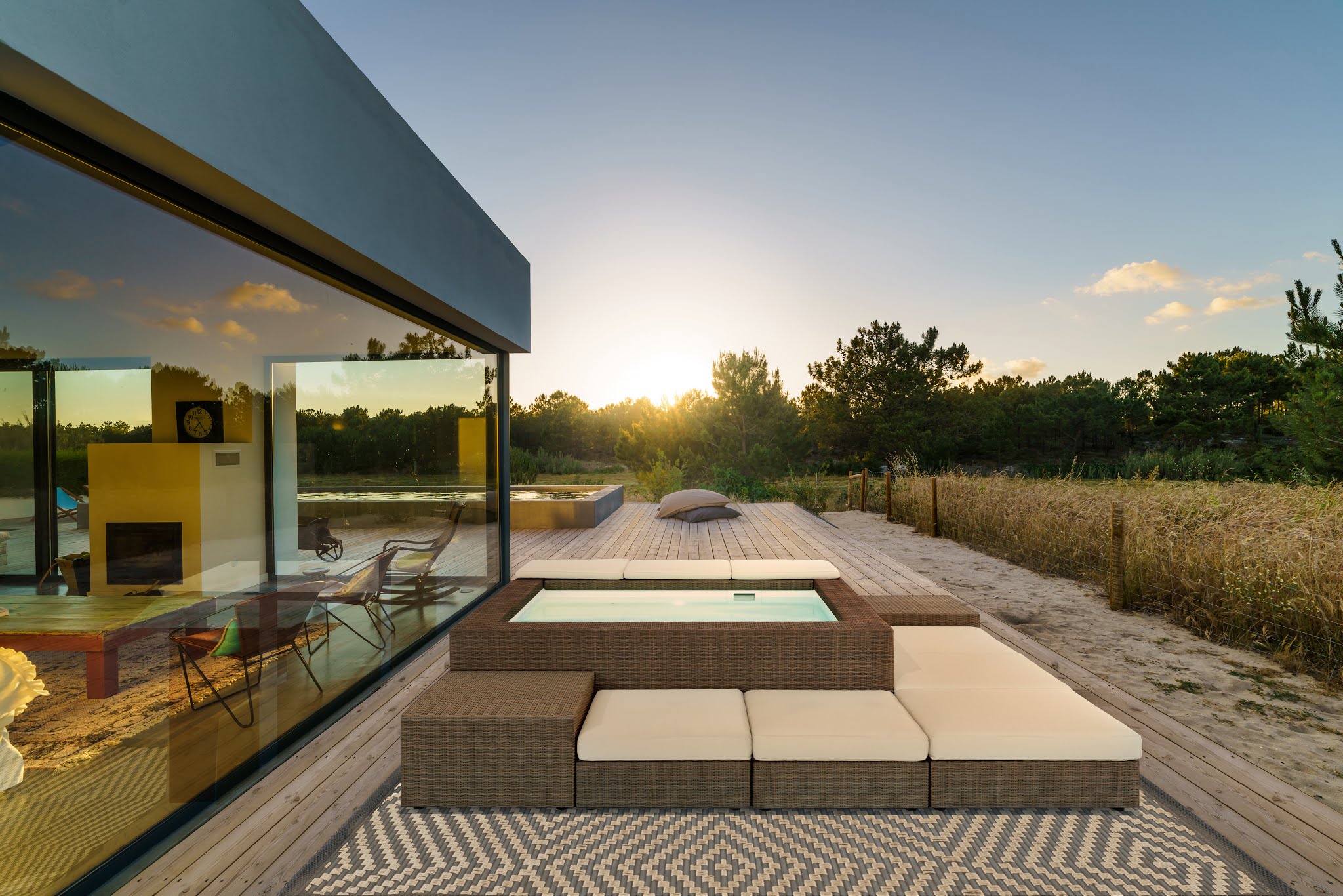 Modern house with garden swimming pool and wooden deck