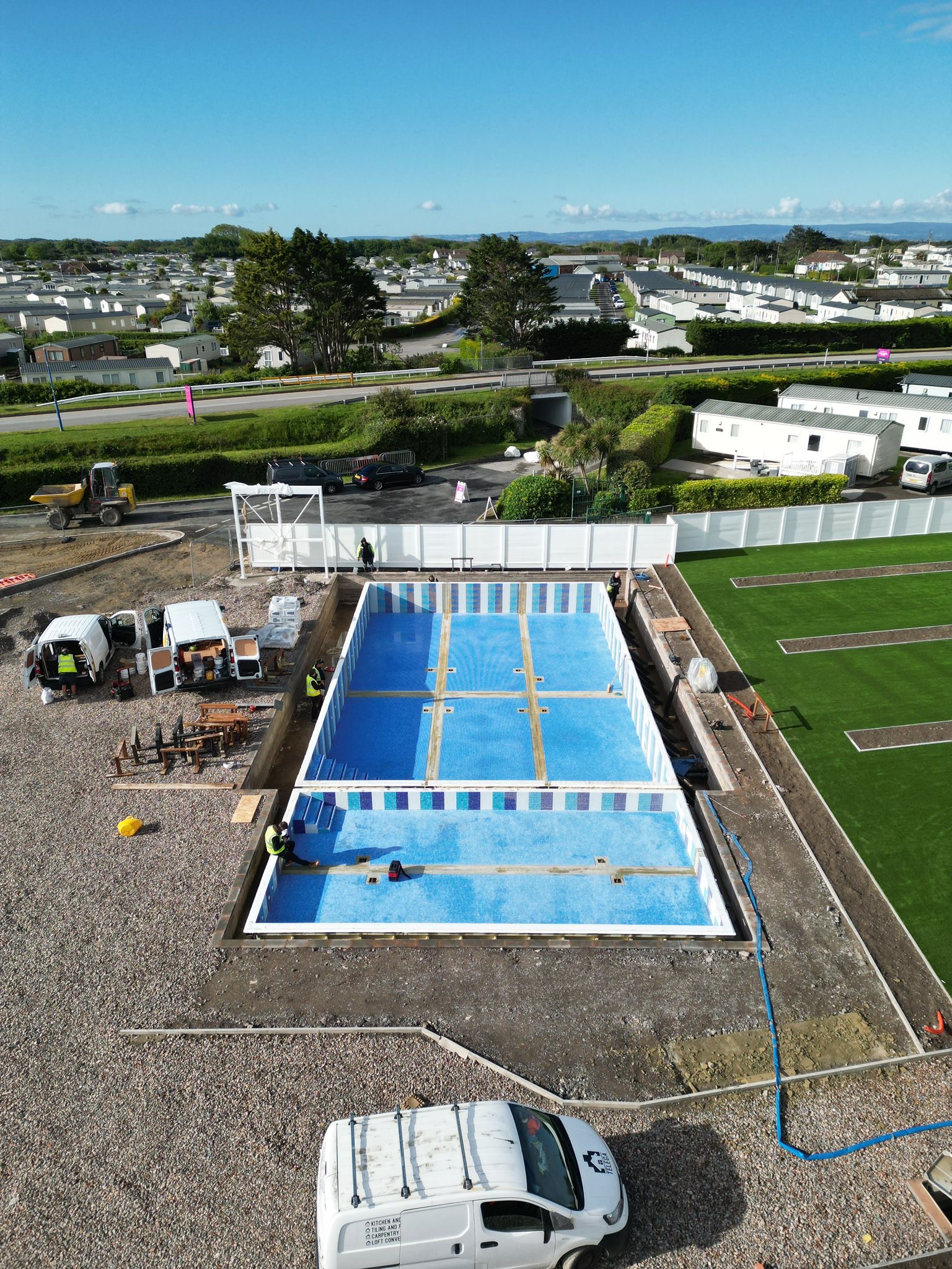 The tiled pool shell with children's splash area ahead of filling and commissioning