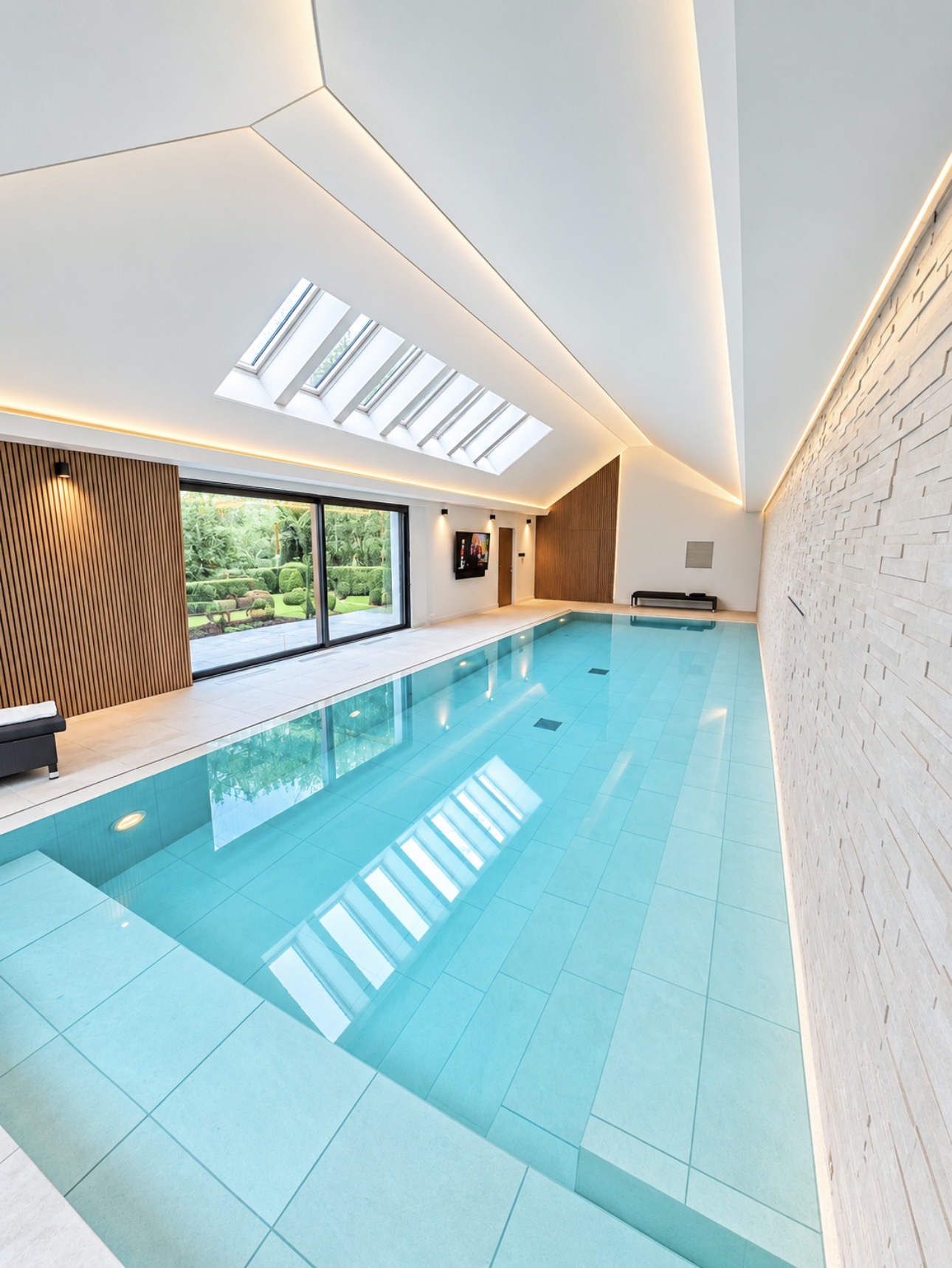 Finished pool with timber wall panelling, stretch ceiling and new steps