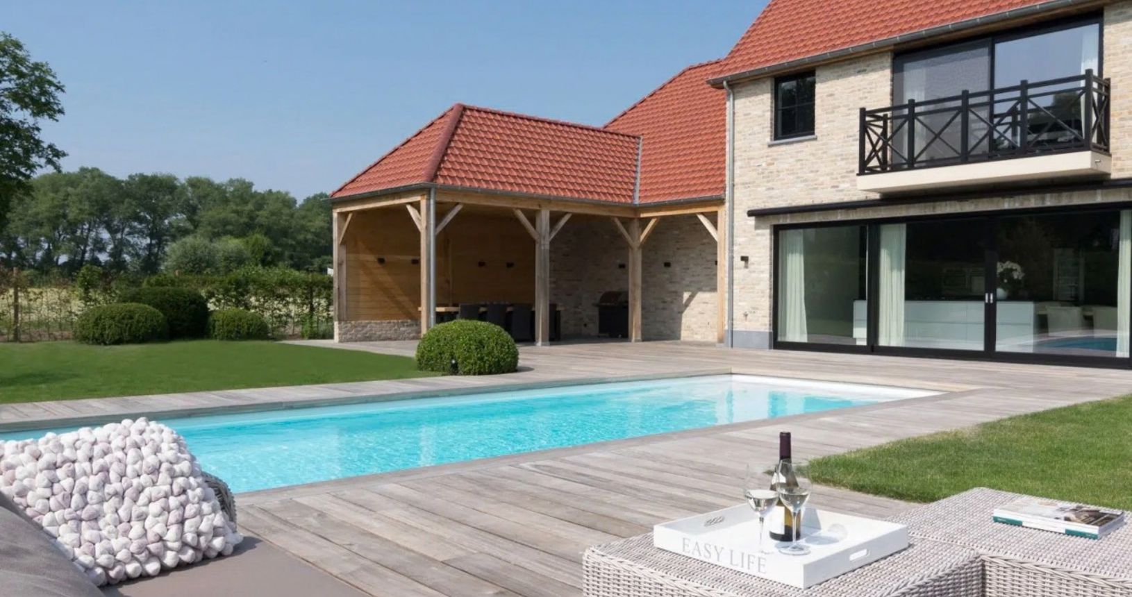 Bespoke outdoor swimming pool designed around the garden
