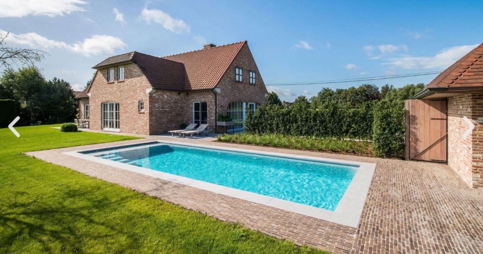 Finished outdoor swimming pool and surrounding garden